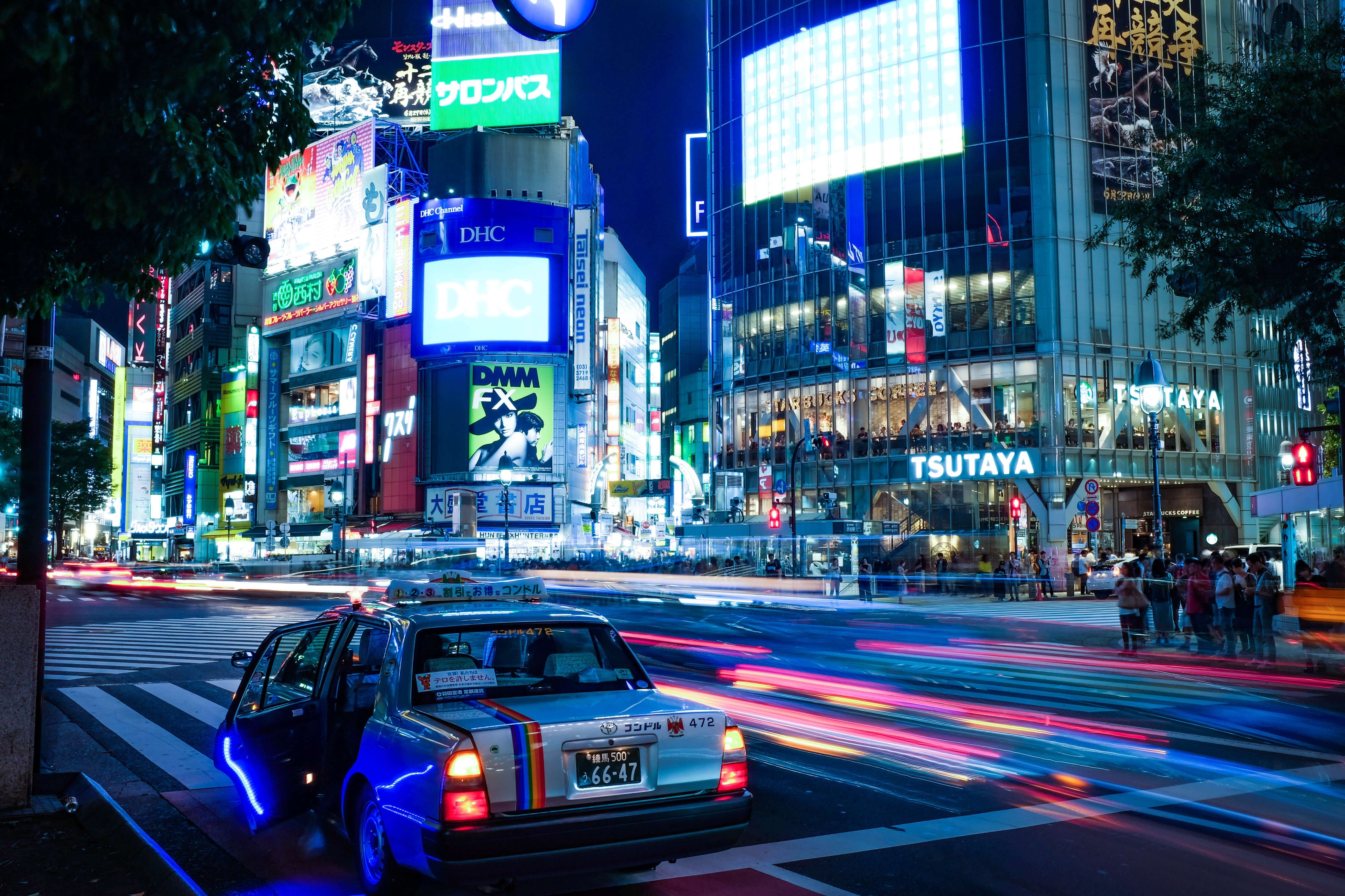 Taxi and colorful lights at night in Tokyo, Japan