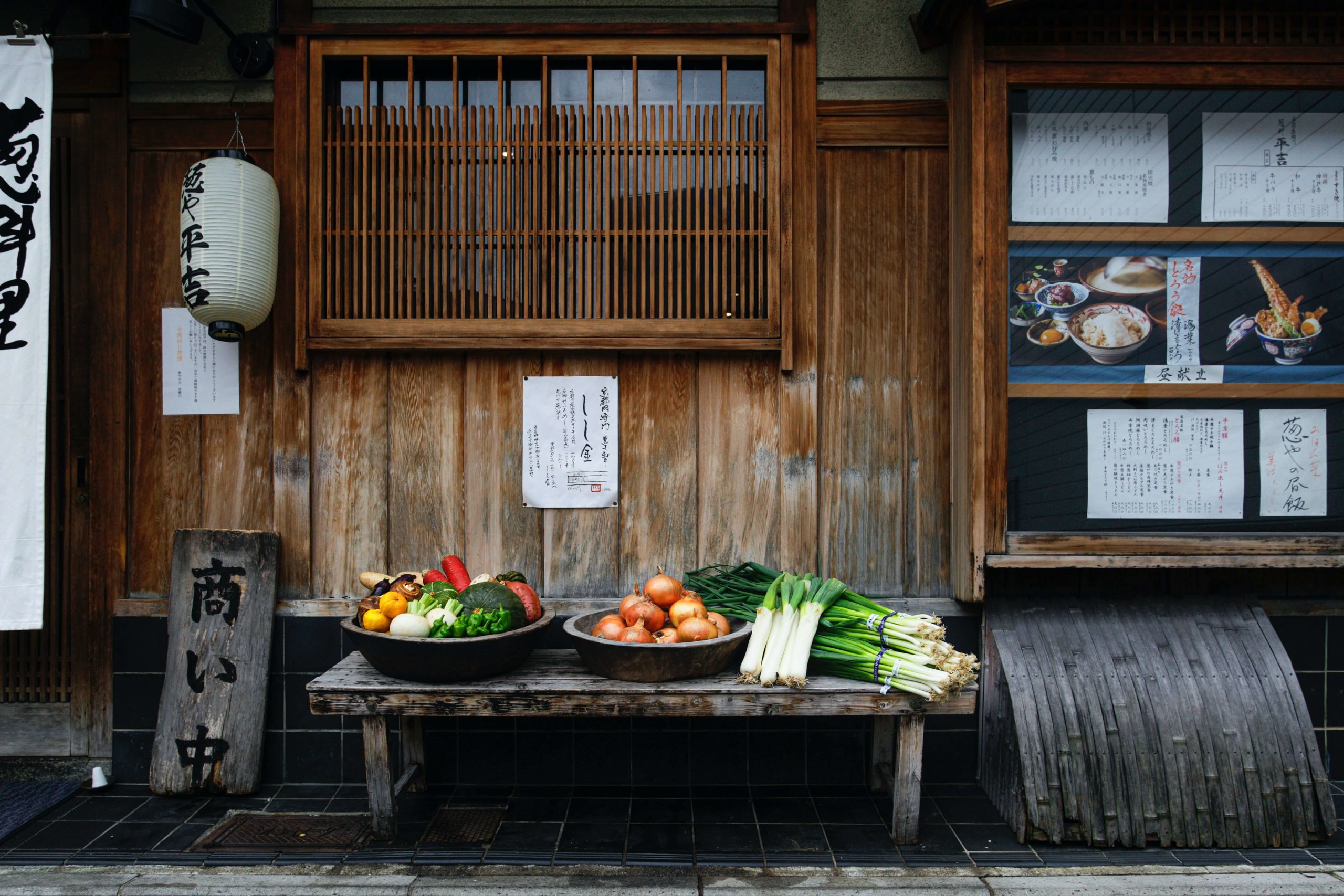 vegetables outside a traditional wooden restaurant in kyoto, japan
